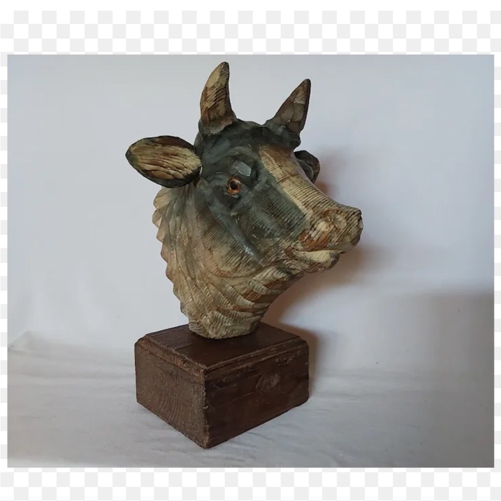 Vintage hand carved wooden cow sculpture.